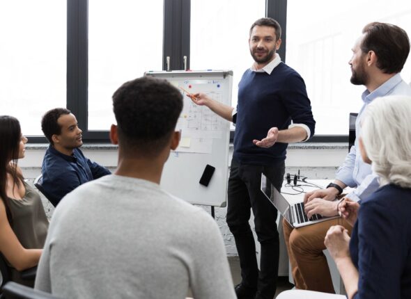 business-team-discussing-their-ideas-while-working-office (1)